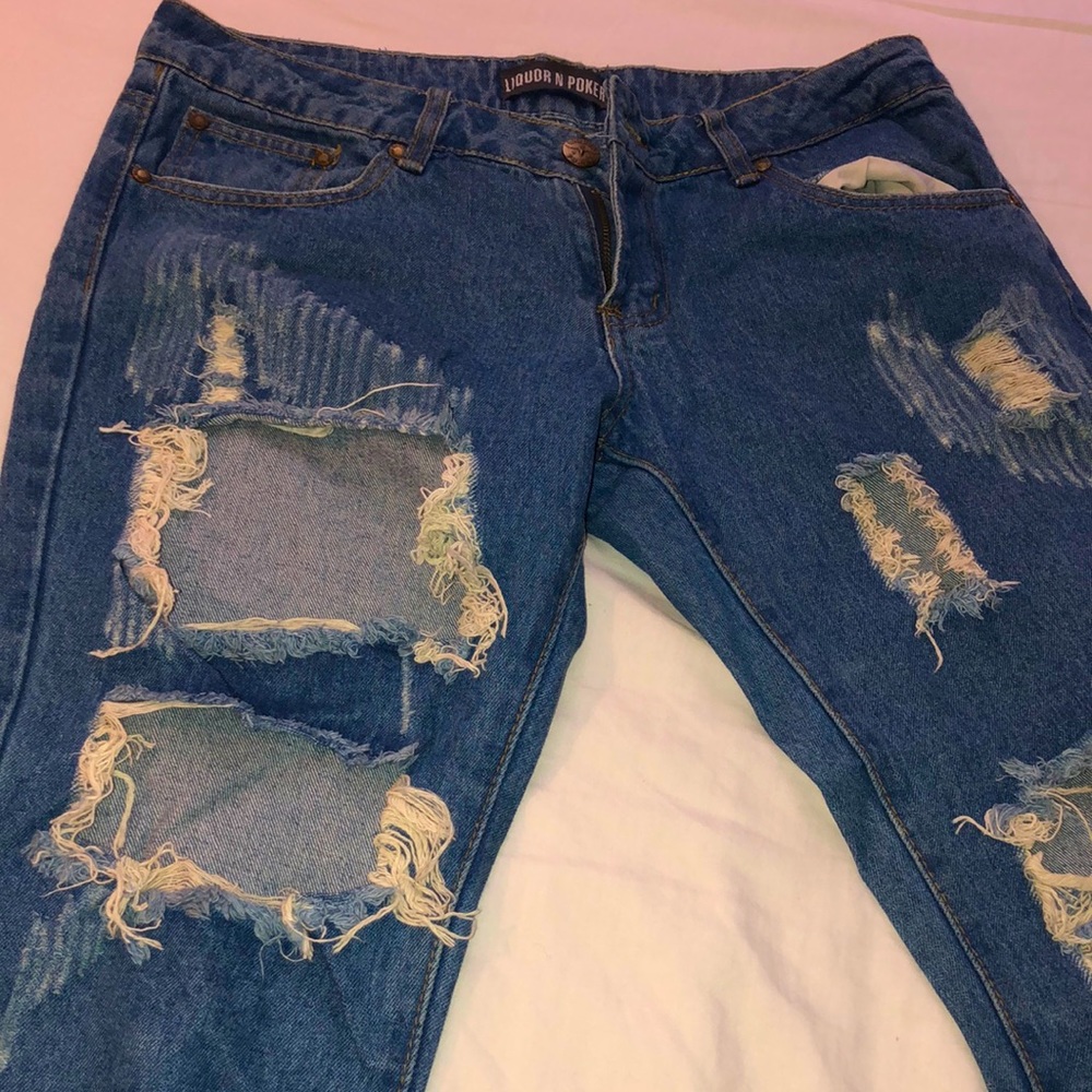 I’m selling a liquor n poker riped denim jeans. N